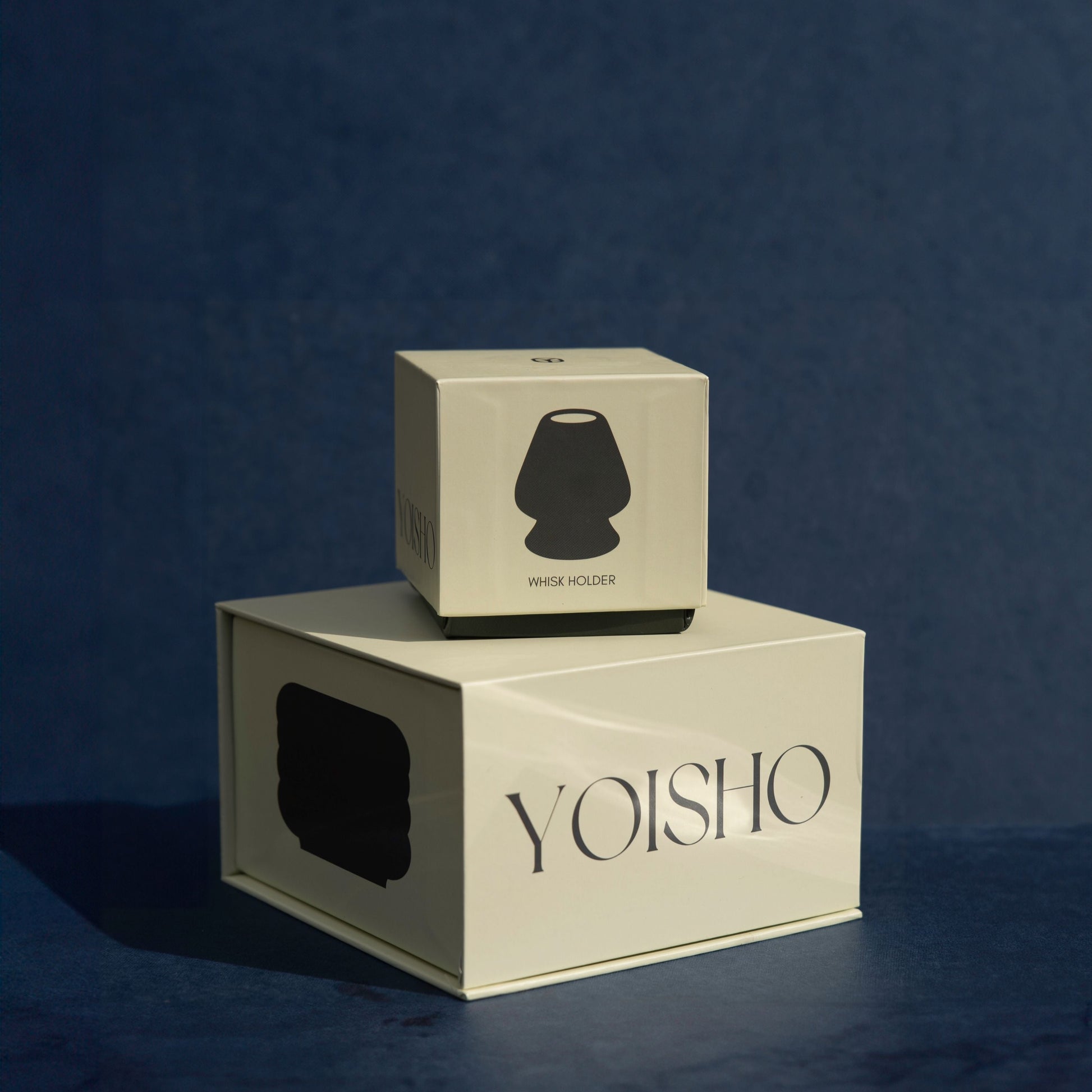 Two beige boxes with 'YOISHO' branding on a dark blue background