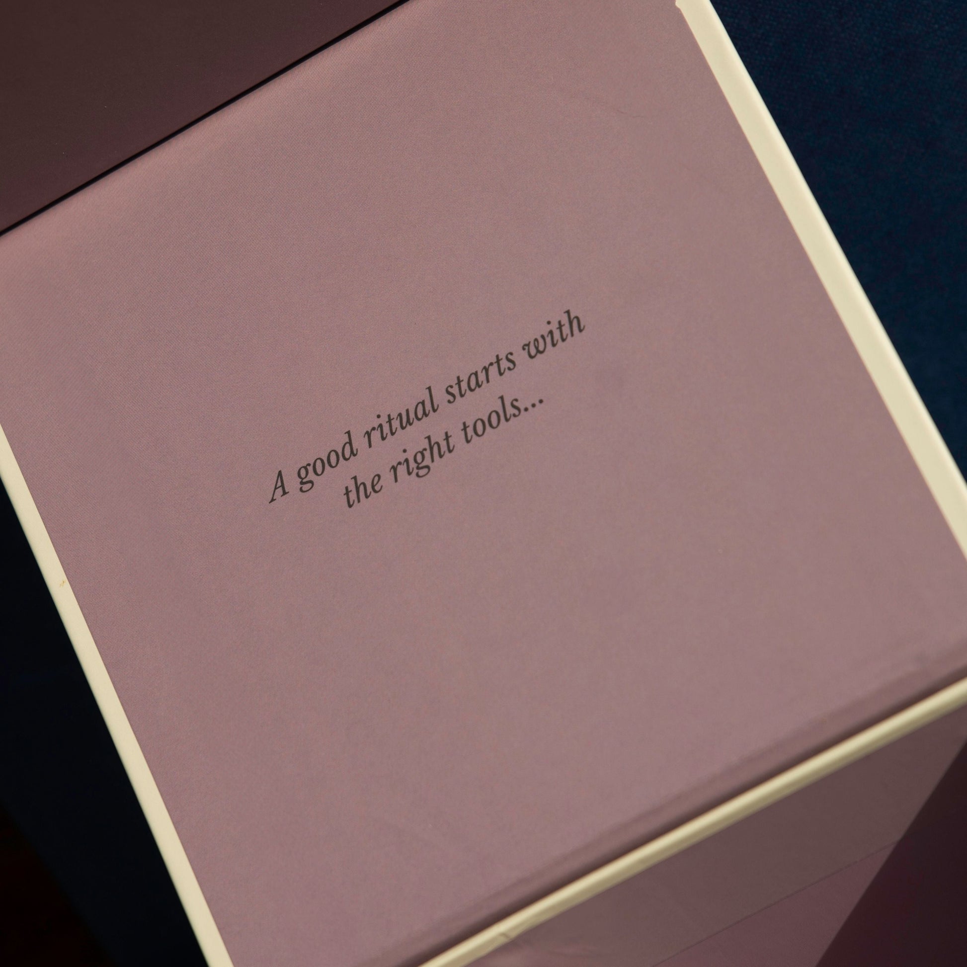 Pink box with text 'A good ritual starts with the right tools...' on a dark background
